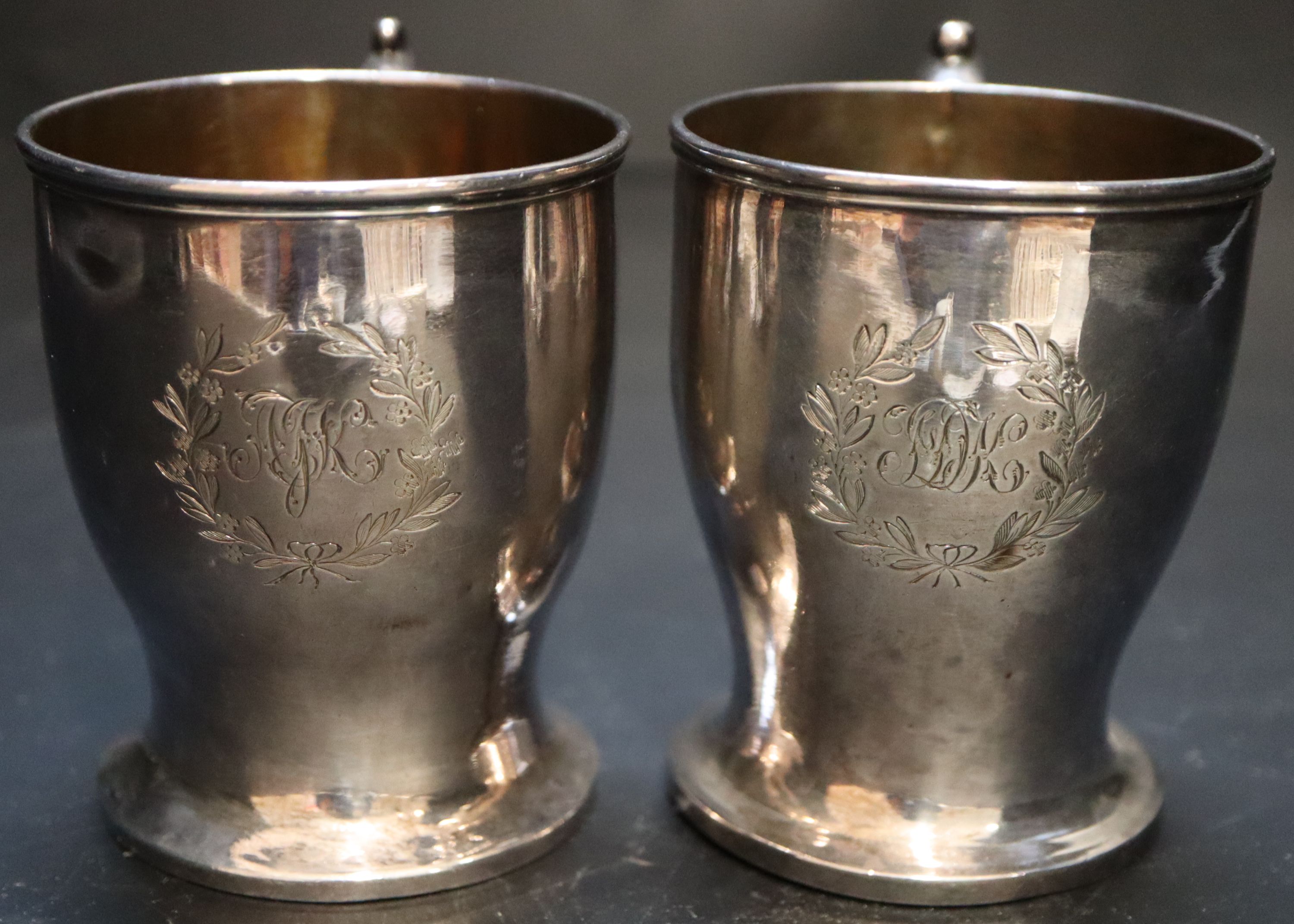 A pair of Victorian silver christening mugs, height 87mm, gross 8oz.